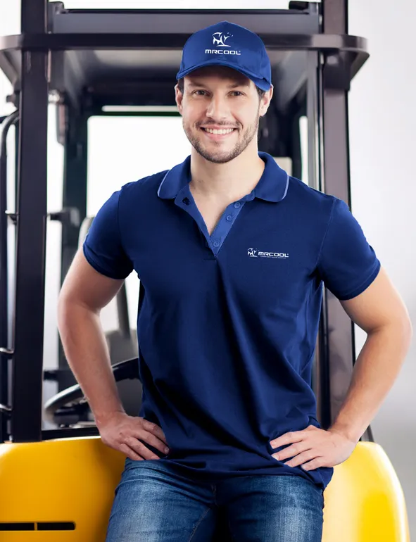 MRCOOL dealer standing in front of air conditioning units